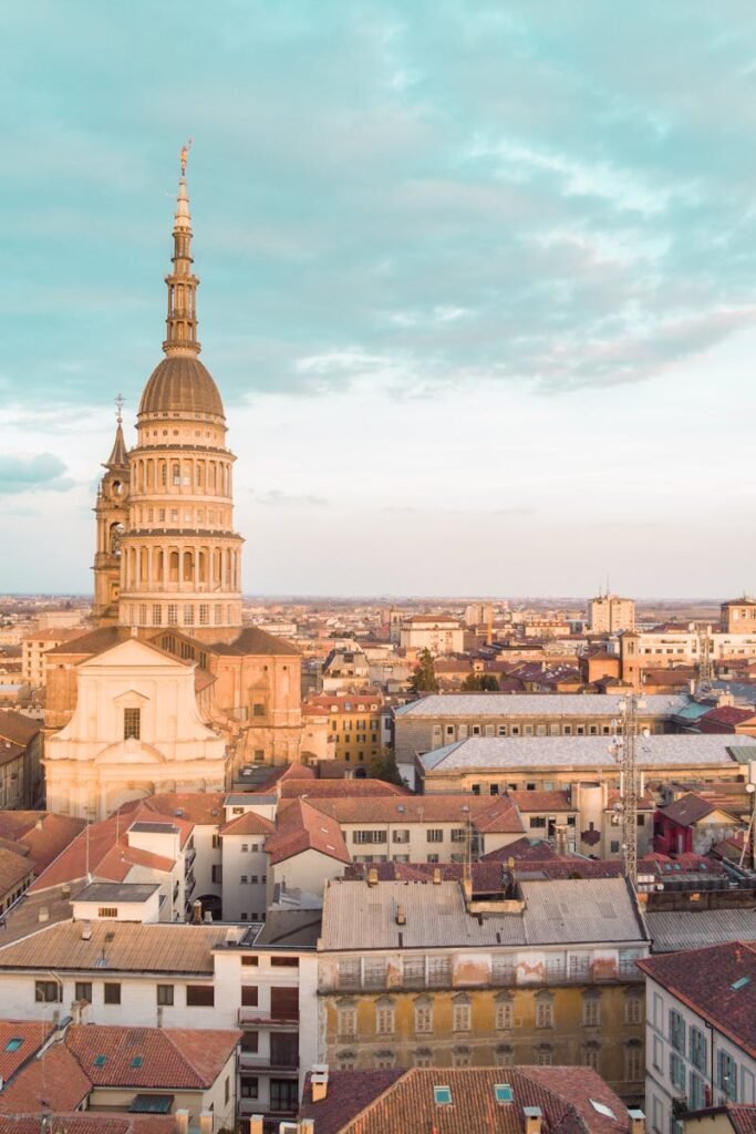 A breathtaking aerial view of Novara, Italy, showcasing the iconic Basilica of San Gaudenzio against a vibrant cityscape.